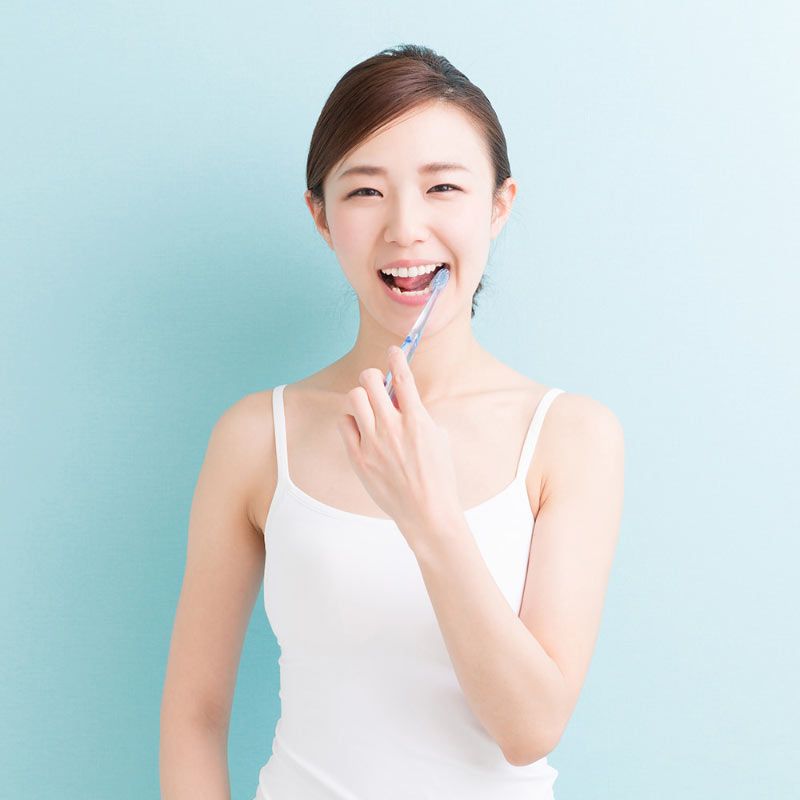 Woman Brushing Teeth