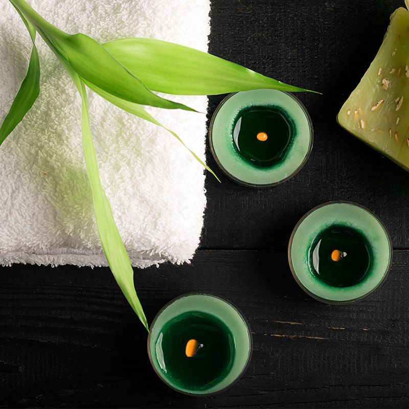 Folded Towel with Candles Burning