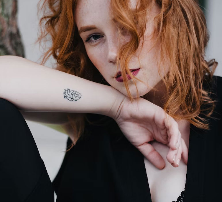Woman with a Tattoo on her Arm